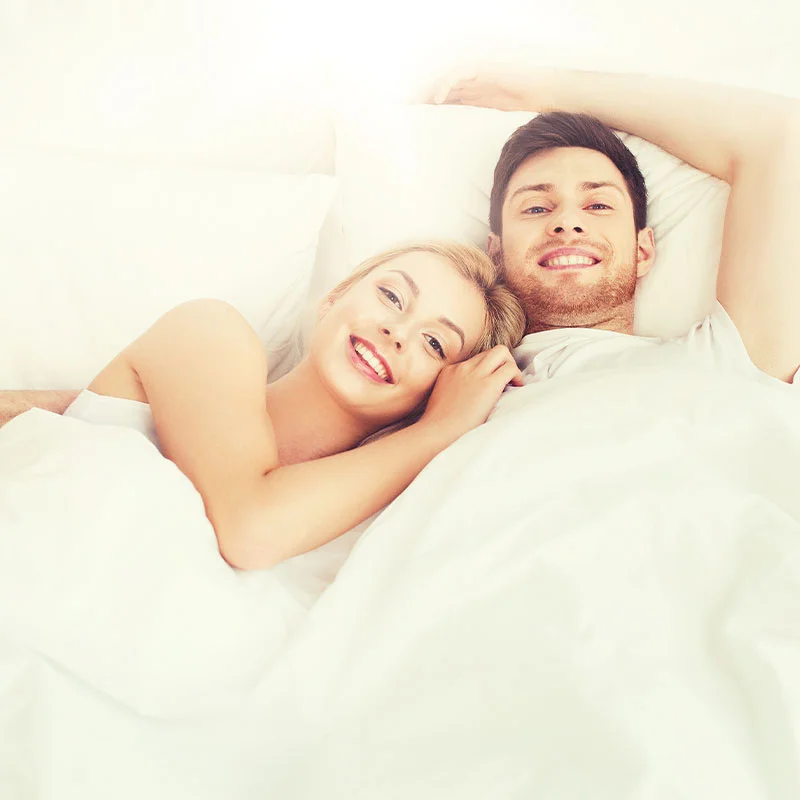 happy couple in bed